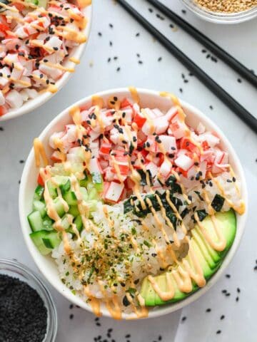California Sushi Bowl with black sesame seeds and chopsticks nearby