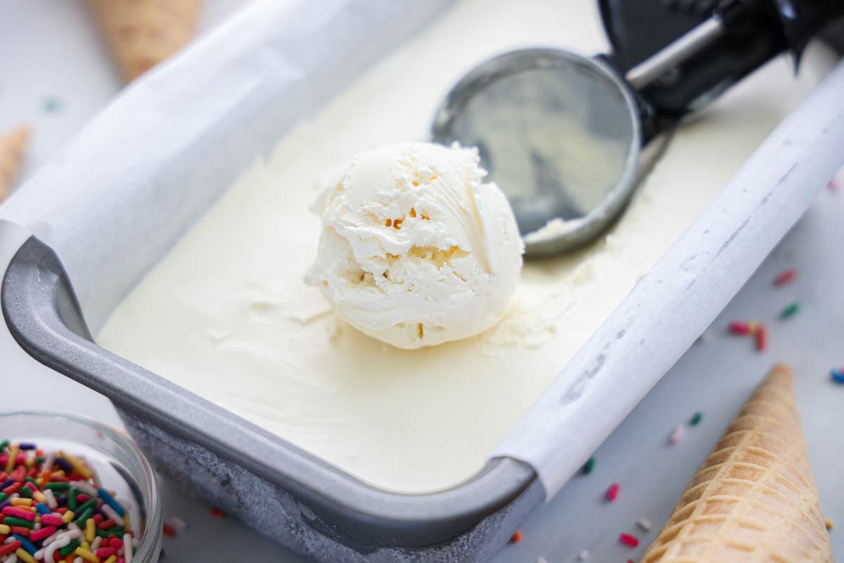 A scoop of ice cream served from a tub of Easy-to-Make Ice Cream.